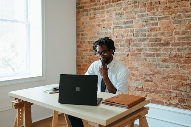 Chief Financial Officer working on a laptop.